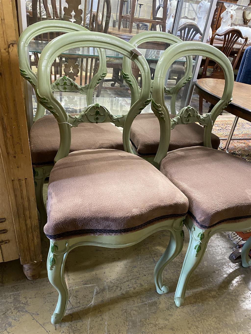 A set of four painted Victorian dining chairs and an oval centre table